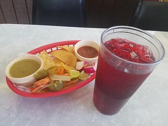 Product: Enjoy a complimentary basket of chips and fresh salsa while you wait for your food. Do not forget to buy agua fresca! What you see here is Jamaica or sweetened iced hibiscus tea. We do also have other fruit options served everyday. - Taqueria Los Gordos in Redding, CA Mexican Restaurants