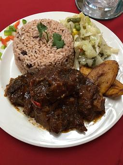 Product: Jenny’s oxtail with rice & peas - Taste Of Caribbean Restaurant & Lounge in Capitol Heights, MD Bars & Grills