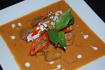 Product: Big chunks of beef simmered over low heat for hours until the beef is tender, juicy and succulent - Thai Curry in Arlington, VA Thai Restaurants