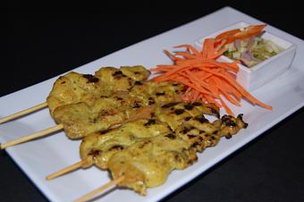 Product: strips of chicken breasts are marinated, then skewered and grilled. Served with toast bread, cucumber relish and homemade peanut sauce. - Thai Curry in Arlington, VA Thai Restaurants
