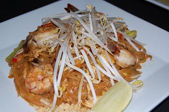 Product: soft nice noodle are flavored with balance of palm sugar, tamarind lime juice and fish sauce. Stir-fried with egg firm tofu, sweet pickled radish, spring onion and crunchy bean spouts with lime wedge and crush peanuts on the side - Thai Curry in Arlington, VA Thai Restaurants