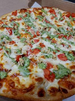 Product: Grilled Chicken, Tomatoes, Cheese, Crushed Walnuts, Parmesan and house made Creamy Pesto! YUP!...it's THAT good! - The 78 Pub @ This Guy's Pizza in Johnston, RI Pizza Restaurant