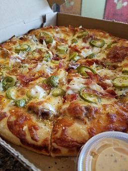 Product: The Level Up Pizza-Shaved steak, onions, crispy bacon, cheese, jalapenos and dusted with Magic Dust and then is served with our newest sauce the Level Up sauce! - The 78 Pub @ This Guy's Pizza in Johnston, RI Pizza Restaurant