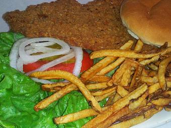 Product: Homemade, handmade, breaded Pork Tenderloin. Seasoned with our own Island Rub. - The BBQ Shack in Paola, KS Barbecue Restaurants