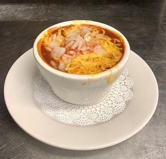 Product: Cup of Chili topped with cheddar cheese and chopped onion. - The Bottom Line in Farragut Square, Downtown - Washington, DC Pubs