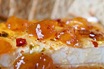 Product: One of the many appetizers to taste before you head to the dinning room! Our best selling Peach Pecan Pepper Preserve! - The Crown Restaurant in Indianola, MS American Restaurants