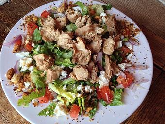 Product: Romaine lettuce with chicken sautéed in Great Grilling Marinade with onion, tomato, Crispy Crumbles and our Vidalia Onion Dressing with a choice of Feta or Parmesan cheese. - The Crown Restaurant in Indianola, MS American Restaurants