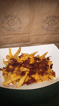 Product: Crispy Golden Fries topped off with Nacho Cheese & Bacon Pieces! - The Elephant Shack in Woodland, CA American Restaurants