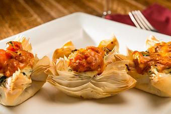 Product: Crab Turnovers with a Roasted Tomato Reduction - The Fish House Restaurant in Peoria, IL Seafood Restaurants