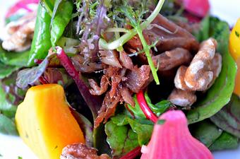 Product: Baby Beet Salad,	
Bitter Greens, Crispy Duck Confit, 
Horseradish Dressing, Walnuts - The Frog & The Peach in New Brunswick, NJ American Restaurants