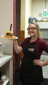 Product: Our Wonderful Server Kate with a Mile High Burger so tall it needs a steak knife to hold it together! - The Hideaway Grill in Payette, ID American Restaurants