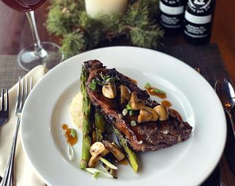 Product: A Hungry Trout tradition, 10 oz sirloin with our homemade Jack Daniels whiskey mushroom sauce. Served with garlic mashed potatoes and grilled asparagus. - The Hungry Trout in Wilmington, NY American Restaurants