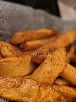 Product: Big happy steak fries seasoned to perfection, nestled in a basket for your enjoyment. - The Original Patsy's Irish Pub, Laguna Niguel in Laguna Niguel, CA Bars & Grills