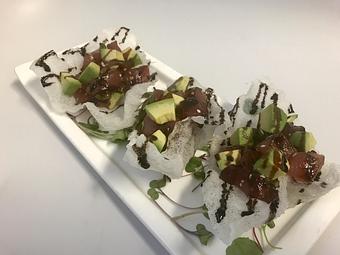 Product: Sashimi grade tuna | Avocado | Scallions Sesame seed | Ponzu | Served in a rice cup - The Pointe Restaurant in Provincetown - Provincetown, MA American Restaurants