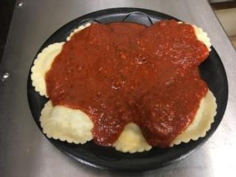 Product: Beef filled Jumbo Ravioli covered with meat or marinara sauce - The Spaghetti Junction in New Albany, IN Italian Restaurants