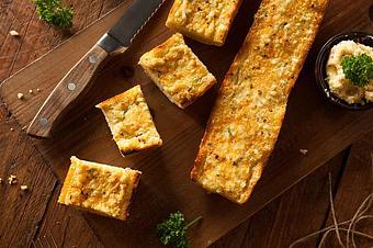 Product: Our Famous Loaf of Garlic Bread! - The Spaghetti Junction in New Albany, IN Italian Restaurants