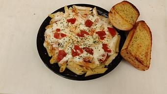 Product: Fettuccine pasta with cajun spiced chicken, tomatoes and Alfredo Sauce - The Spaghetti Junction in New Albany, IN Italian Restaurants