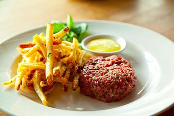 Product: Seasonally inspired menu with daily specials. Pictured: Steak Tartare with Frites. - The Waterboy in Sacramento, CA American Restaurants