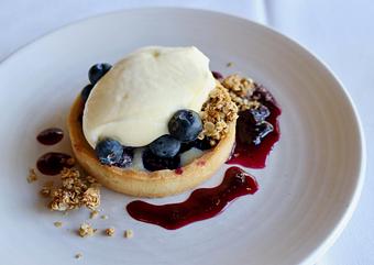 Product: Seasonally inspired menu with daily specials. Pictured: Rhythm & Blueberries Tart - The Waterboy in Sacramento, CA American Restaurants