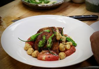 Product: Seasonally inspired menu with daily specials. Pictured: "Chicken Under a Brick" with Heirloom Tomatoes, Sweet Corn, Shishito Peppers & Gnocchi Frito. - The Waterboy in Sacramento, CA American Restaurants