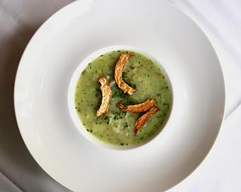 Product: Seasonally inspired menu with daily specials. Pictured: Potato-Watercress Soup with Chives & Fried Artichokes - The Waterboy in Sacramento, CA American Restaurants