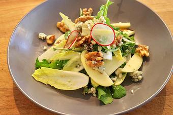 Product: Seasonally inspired menu with daily specials. Pictured: Endive & Arugula Salad with Local Apples, Glazed Walnuts, Point Reyes Bay Bleu & Balsamico - The Waterboy in Sacramento, CA American Restaurants