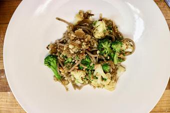 Product: Seasonally inspired menu with daily specials. Pictured: Housemade Whole Wheat Spaghetti with Roasted Cauliflower, Broccoli, Caramelized Onions, Farro, Toasted Almonds, Sheep's Milk Cheese & Olives - The Waterboy in Sacramento, CA American Restaurants