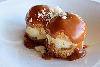 Product: Seasonally inspired menu with daily specials. Pictured: Profiteroles with Macadamia Nut Ice Cream, Salted Caramel, White Chocolate Crumble - The Waterboy in Sacramento, CA American Restaurants