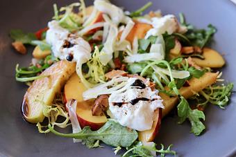 Product: Salad of Arugula & Frisee with Local Peaches, Almonds, Shaved Fennel, Burrata & Balsamico - The Waterboy in Sacramento, CA American Restaurants