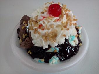 Product: This sundae starts with two of our best ice cream flavors: Birthday cake and dark chocolate, we then add hot fudge, whipped cream, nuts and a cherry!  YUM! - The Widow's Walk Ice Creamery & Bicycle Rentals in Clarksville, IN American Restaurants