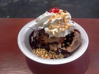 Product: This is what we are known for:  It is warm brownies, topped with peanut buttercup ice cream, hot fudge, whipped cream, nuts and a cherry! - The Widow's Walk Ice Creamery & Bicycle Rentals in Clarksville, IN American Restaurants