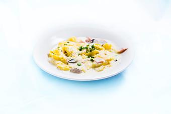 Product: Cheese tortellini w/cream sauce, ham, mushrooms and peas. - Tiramisu in Quincy, IL Italian Restaurants