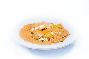 Product: Portobelto mushroom ravioli w/our famous 'pink" sauce. - Tiramisu in Quincy, IL Italian Restaurants