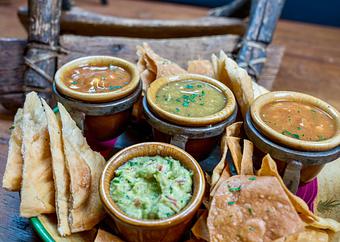 Product: Three Sister Salsas & Guacamole
Trio of chips: Corn, flour & fry bread
Salsas of:
– Corn & tomato
– Chayote squash & tomatillo
– Tepary bean & red chilies - Tonto Bar & Grill in Rancho Manana - Cave Creek, AZ American Restaurants