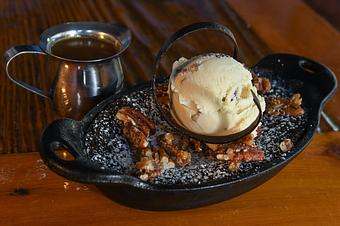 Product: Chocolate Fudge Brownie Cake
Chocolate chunk brownie, caramel sauce, butter pecan ice cream, candied pecans, chocolate twist
GFO & VEGAN - Tonto Bar & Grill in Rancho Manana - Cave Creek, AZ American Restaurants