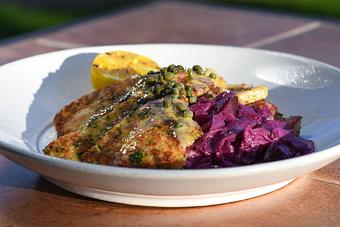 Product: German Pork Schnitzel
Housemade German potato salad with bacon, lemon caper butter, braised red cabbage with apples,
and a grilled lemon - Tonto Bar & Grill in Rancho Manana - Cave Creek, AZ American Restaurants