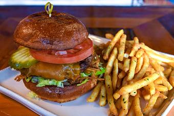 Product: Organic Grass-fed patty
Sharp cheddar -or- Pepper Jack
Lettuce, tomato, pickle planks, crispy Mesquite flour-fried onions, and house-made brioche bun - Tonto Bar & Grill in Rancho Manana - Cave Creek, AZ American Restaurants