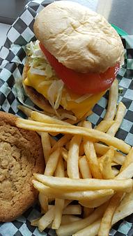 Product: Cheeseburger with lettuce, tomato, pickles and onions - Trio Bar & Grill in Enderlin, ND American Restaurants