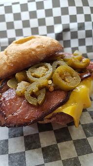 Product: Jalapenos, bacon and cheese on a the burger, served with fries - Trio Bar & Grill in Enderlin, ND American Restaurants