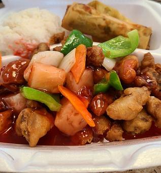 Product: Breaded pork with onions green pepper carrots and pineapple chunks cover with some sweet and Sour sauce - Tsing Tsao Chinese Fast Food in Des Moines, IA Chinese Restaurants