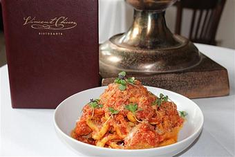 Product: Vincent's Meatballs, House Tomato Sauce, Parmesan Cheese. Bucatini is a hollow spaghetti like pasta - Vincent Chiccos in Upper King St, in Downtown Charleston - Charleston, SC Italian Restaurants