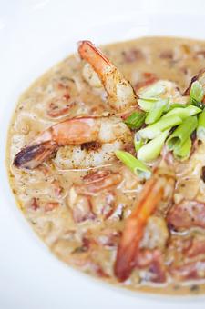 Product: Charleston Shrimp & Grits*
sautéed and simmered in a spicy tomato cream sauce
 over creamy stone ground white cheddar grits - Wahoo! Grill in Decatur / Oakhurst / Atlanta - Decatur, GA Seafood Restaurants