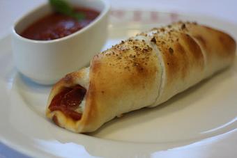 Product: Pepperoni Calzone - Warren Street Pizzeria & Cafe in Newark, NJ Pizza Restaurant