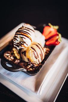 Product: Ultimate Dark Chocolate Brownie with Maple Soaked Walnuts, Salted Caramel Ice Cream, & Seacrest Strawberries - Wolfgang Puck Bar & Grill in Downtown LA/LA Live - Los Angeles, CA American Restaurants