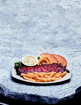Product: Baby Back Ribs - Woody's Bar-B-Q in Macclenny, FL Barbecue Restaurants