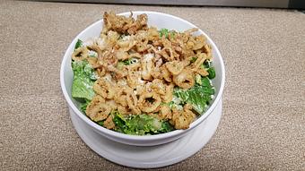 Product: Calamari Caesar salad - Yianni's Restaurant & Bar in Gates Center - Rochester, NY Italian Restaurants
