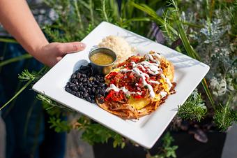 Product: Scrambled Eggs with Peppers, Onions, and Chorizo on Fried Corn Tortillas
served with Pico de Gallo, Lime Crema and a Side of Black Beans and Salsa Verde. - Midtown Cafe in Nashville, TN American Restaurants Product: Scrambled Eggs with Peppers, Onions, and Chorizo on Fried Corn Tortillas
served with Pico de Gallo, Lime Crema and a Side of Black Beans and Salsa Verde. - Midtown Cafe in Nashville, TN American Restaurants