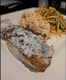 Product: Blackened sea bass filet served with lobster risotto and julienned vegetables. - Midtown Cafe in Nashville, TN American Restaurants Product: Blackened sea bass filet served with lobster risotto and julienned vegetables. - Midtown Cafe in Nashville, TN American Restaurants