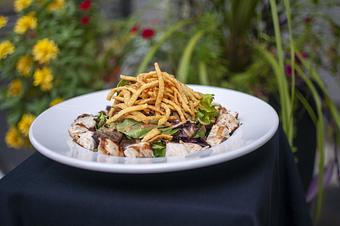 Product: grilled 6oz chicken breast, organic mixed greens and dried
cranberries tossed in honey lime vinaigrette, topped with peanut sauce and crispy wontons. - Midtown Cafe in Nashville, TN American Restaurants Product: grilled 6oz chicken breast, organic mixed greens and dried
cranberries tossed in honey lime vinaigrette, topped with peanut sauce and crispy wontons. - Midtown Cafe in Nashville, TN American Restaurants