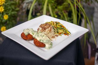Product: Pan sautéed classic Southern croquettes topped with sweet pea cream sauce,
served with rice pilaf and vegetable medley confetti. - Midtown Cafe in Nashville, TN American Restaurants Product: Pan sautéed classic Southern croquettes topped with sweet pea cream sauce,
served with rice pilaf and vegetable medley confetti. - Midtown Cafe in Nashville, TN American Restaurants